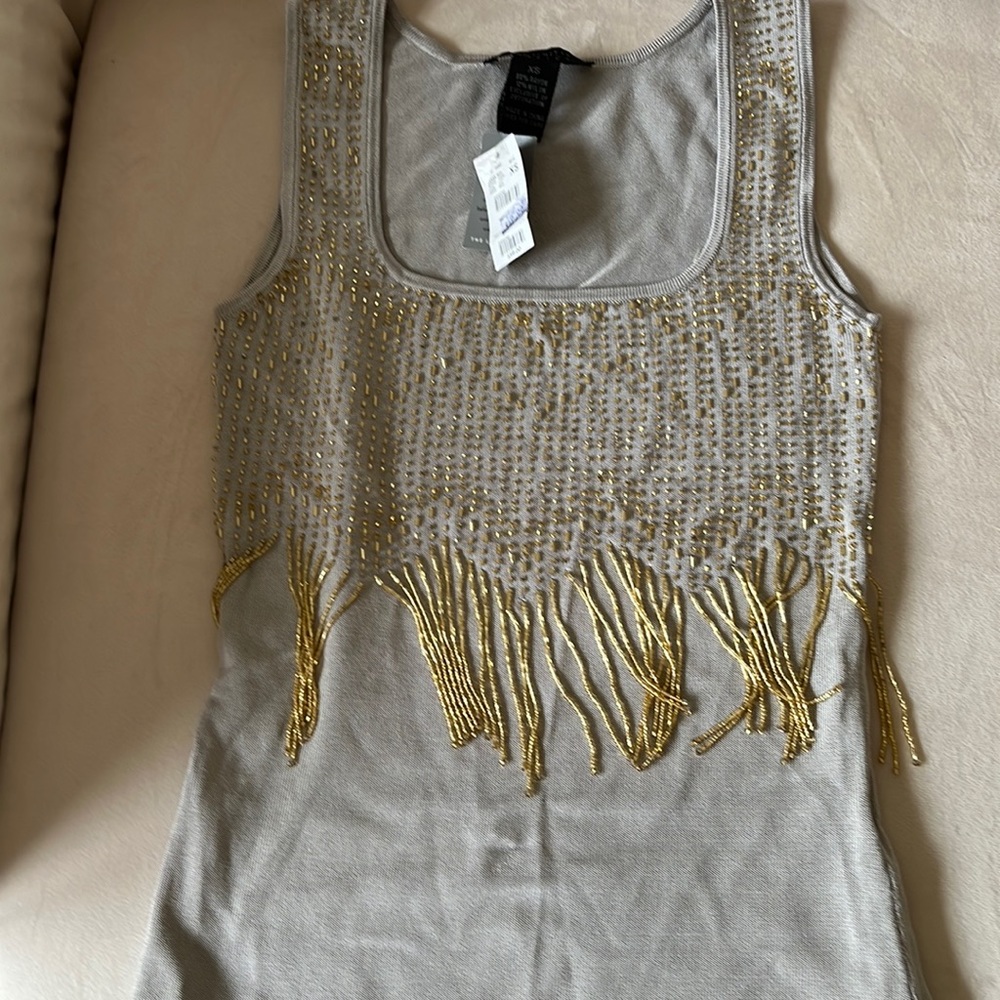 Pretty little blouse with gold beads..